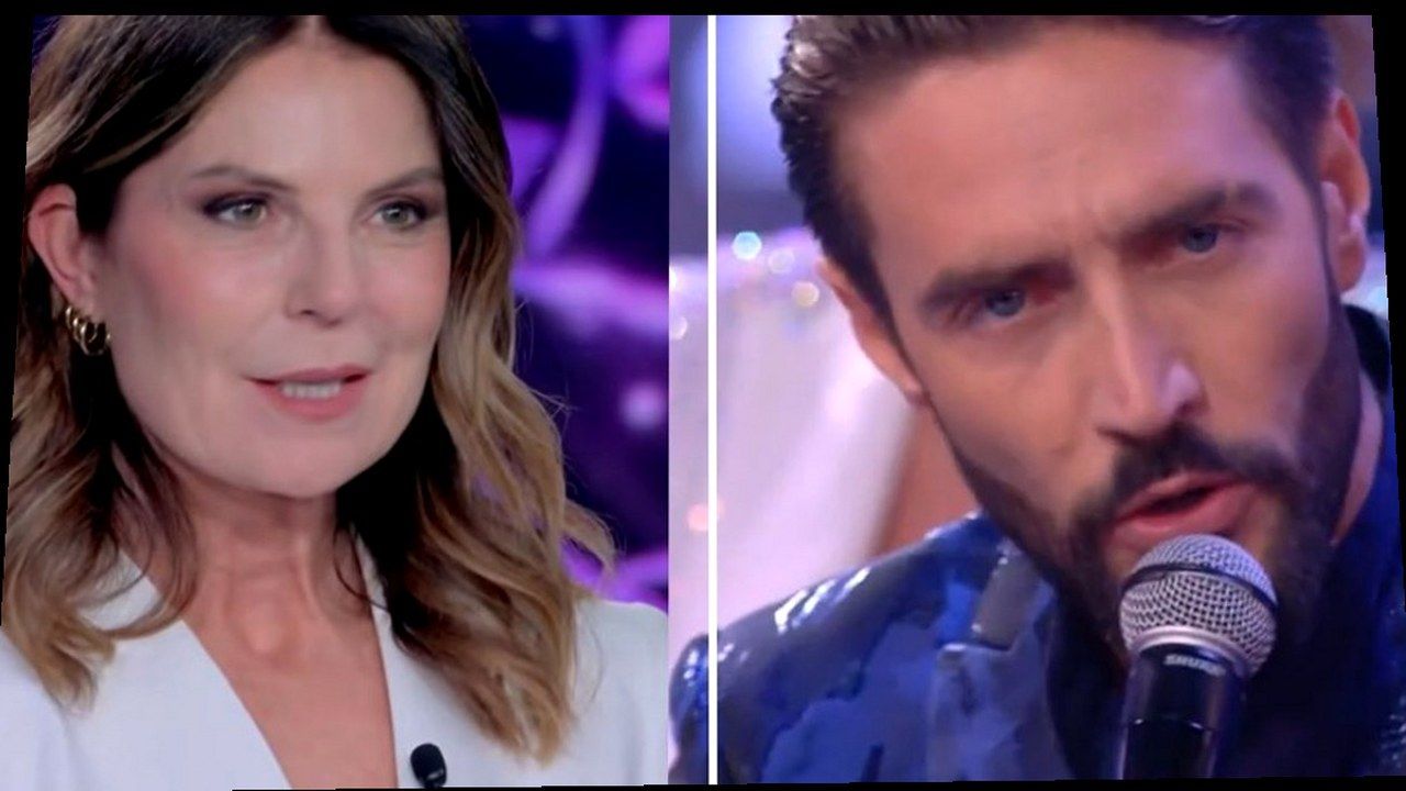 Marina La Rosa e Alex Belli al Grande Fratello Vip 9 — cover Bigodino, warp geometrico (volti invariati)