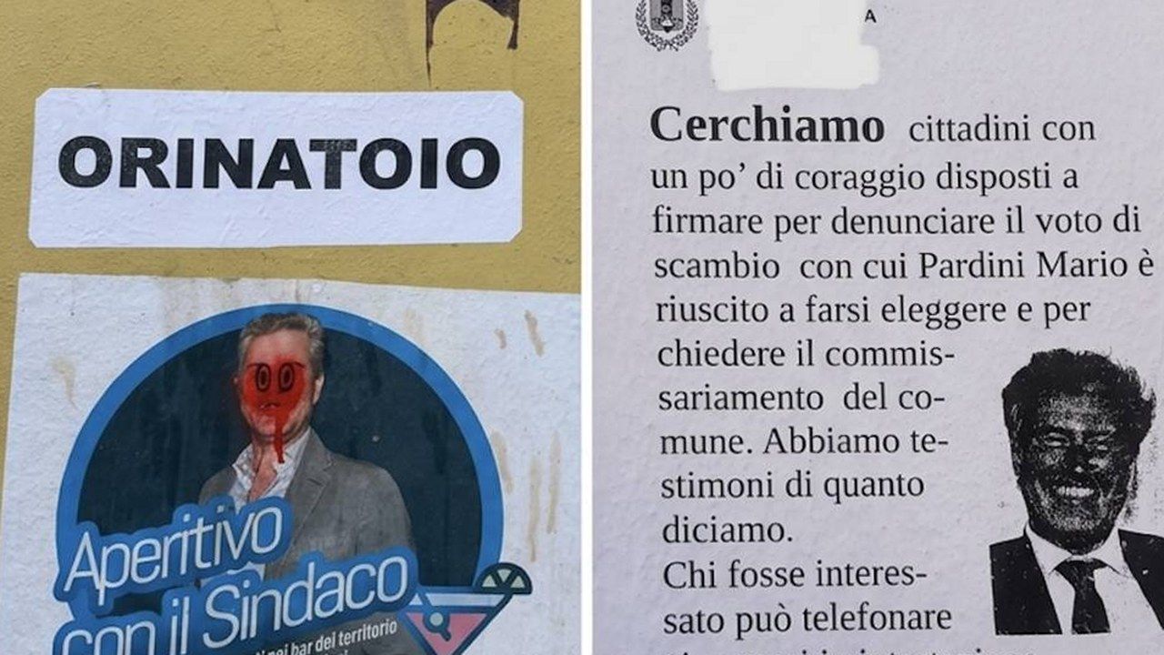 Volantino e adesivo contro il sindaco Mario Pardini affissi sui muri del centro di Lucca