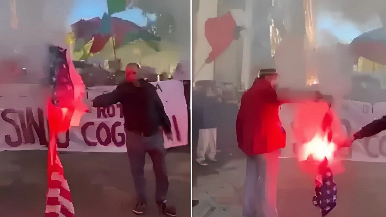 La bandiera americana bruciata in piazza Napoleone a Lucca durante il corteo degli studenti contro il carovita